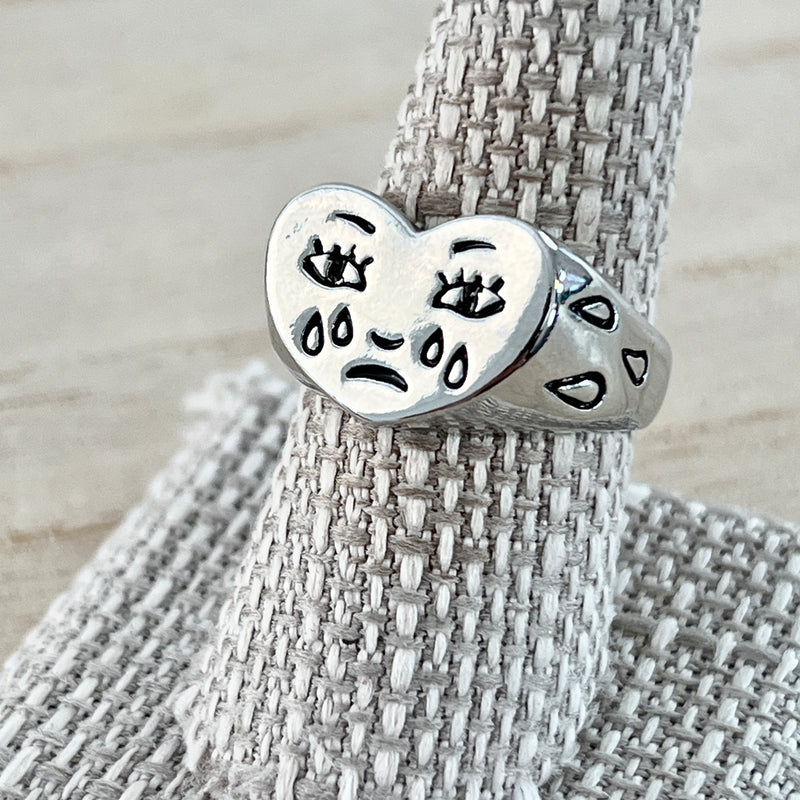 Crying heart face ring discount